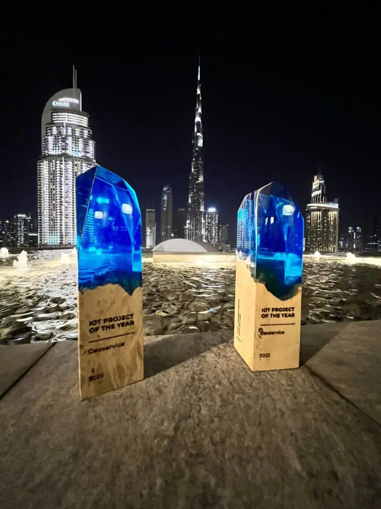 IoT Project of the Year trophies with the Dubai skyline in the background